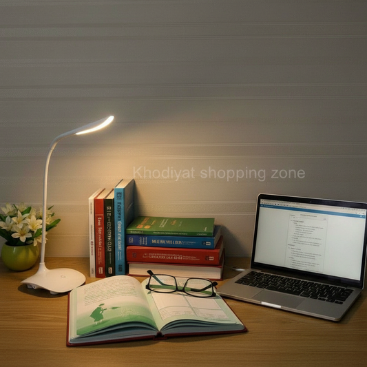 Study desk with lamp and books